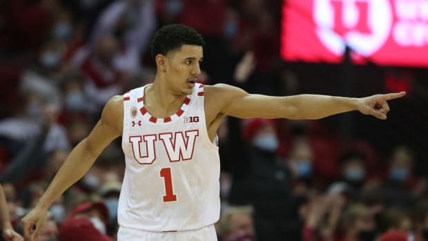 Wisconsin Badgers guard Johnny Davis (1) acknowledges an assist after completing a three-point basket during the game with the Iowa Hawkeyes during the first half at the Kohl Center.